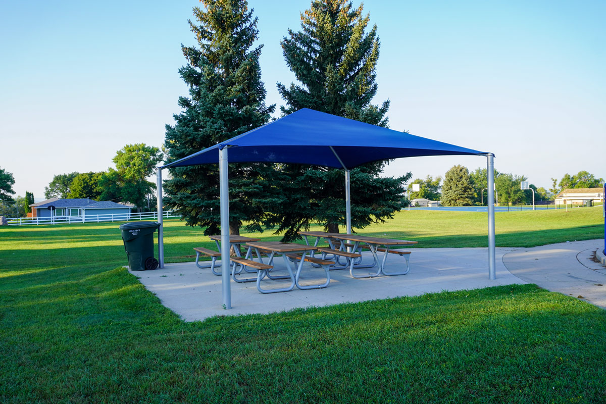 shelter with four picnic tables at 23rd Street Park