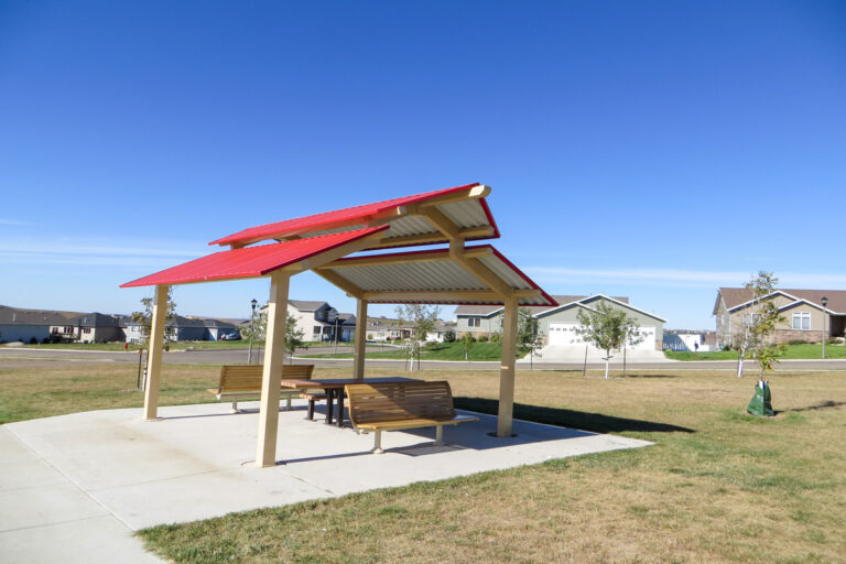 small picnic shelter with picnic table and benches at New Generations Park