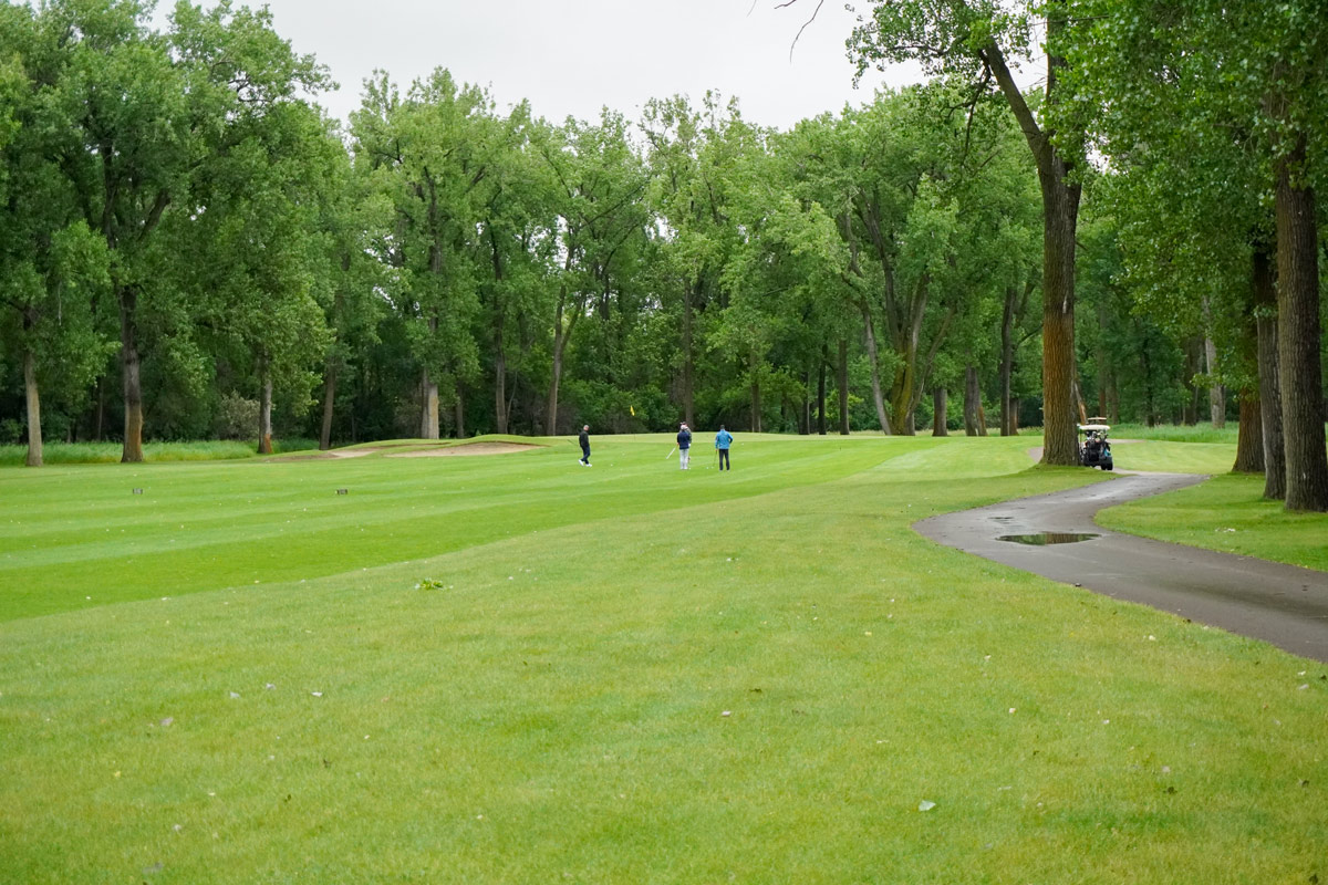 wide angle view of the fairway of a golf course