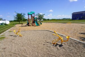 sand diggers with playground in background at Southland Park